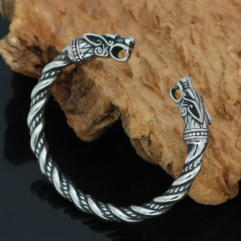 Ancient design inspired by Viking treasures, stylized wolf heads