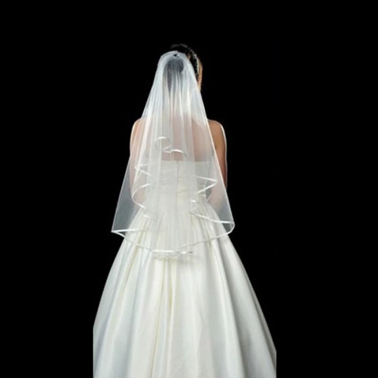 White veil adding refinement to wedding attire
