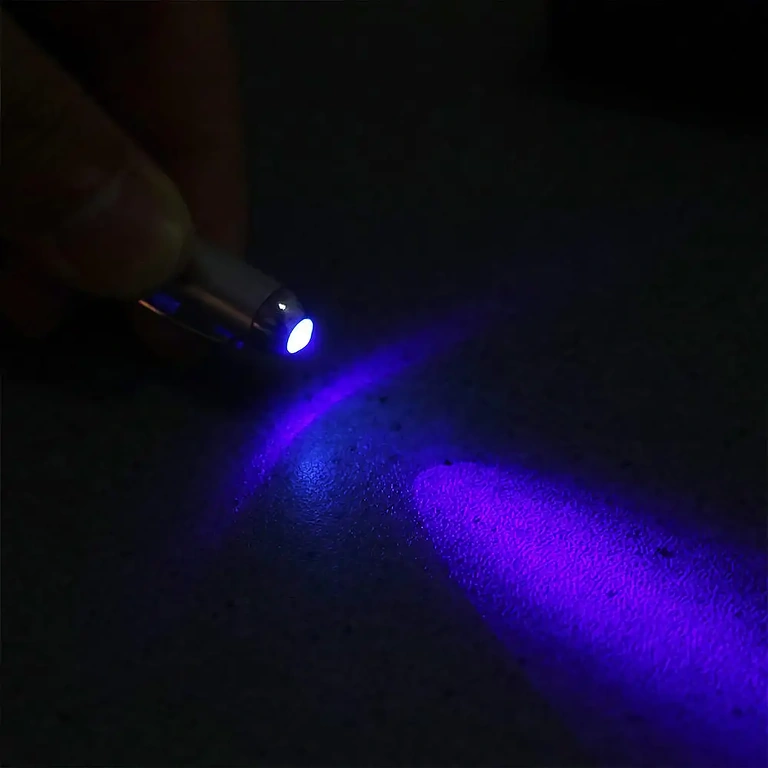 Smart toy pen with ink visible only under UV light