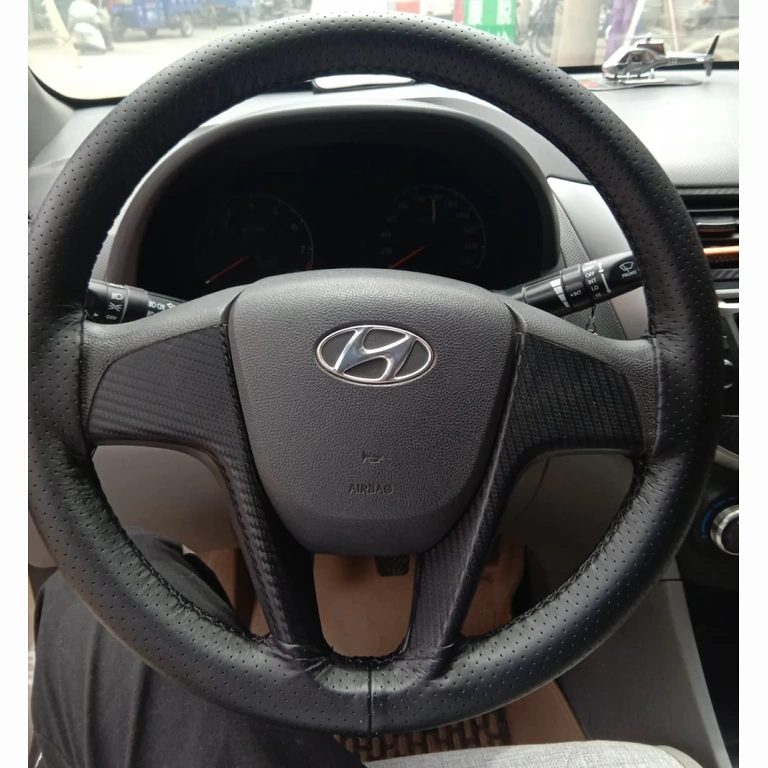 Black leather cover with grippy texture for comfortable driving