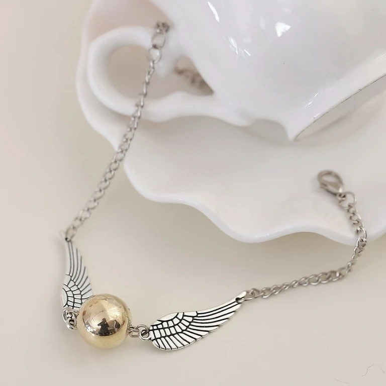 Gold bracelet with Snitch pendant, casual style