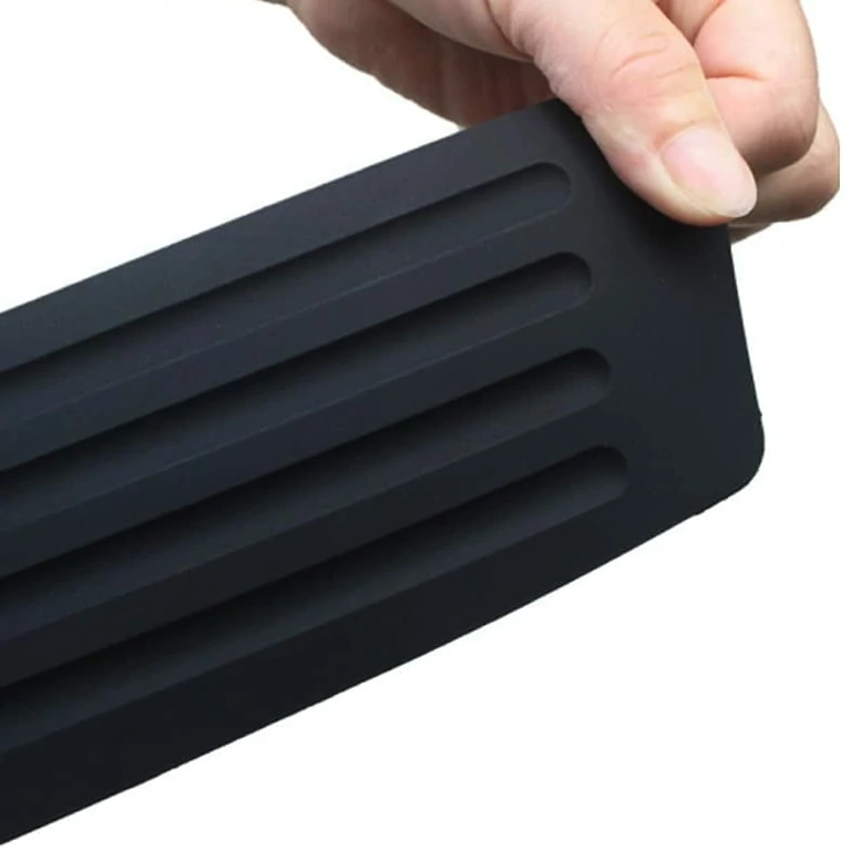 Rubber strip for covering scratches on car rear bumper