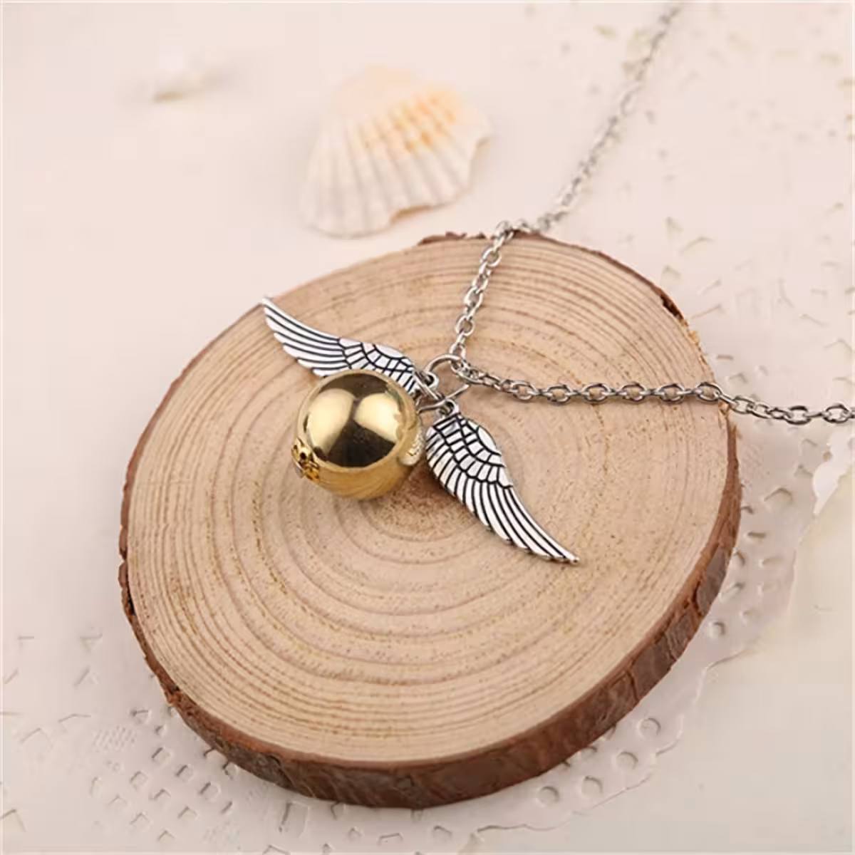 Pendant with golden Snitch and angel wings – Harry Potter style