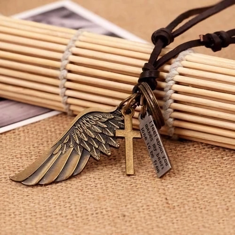 Vintage men’s necklace with cross and wing pendant