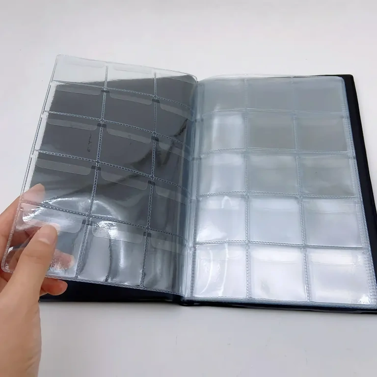 Album with grids and flaps for secure coin placement