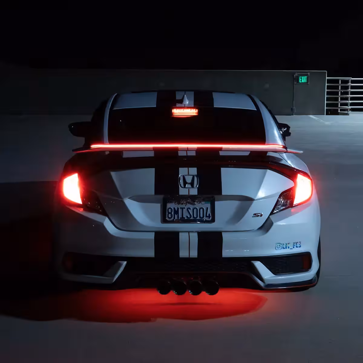 Trunk spoiler with LED strip and integrated brake light