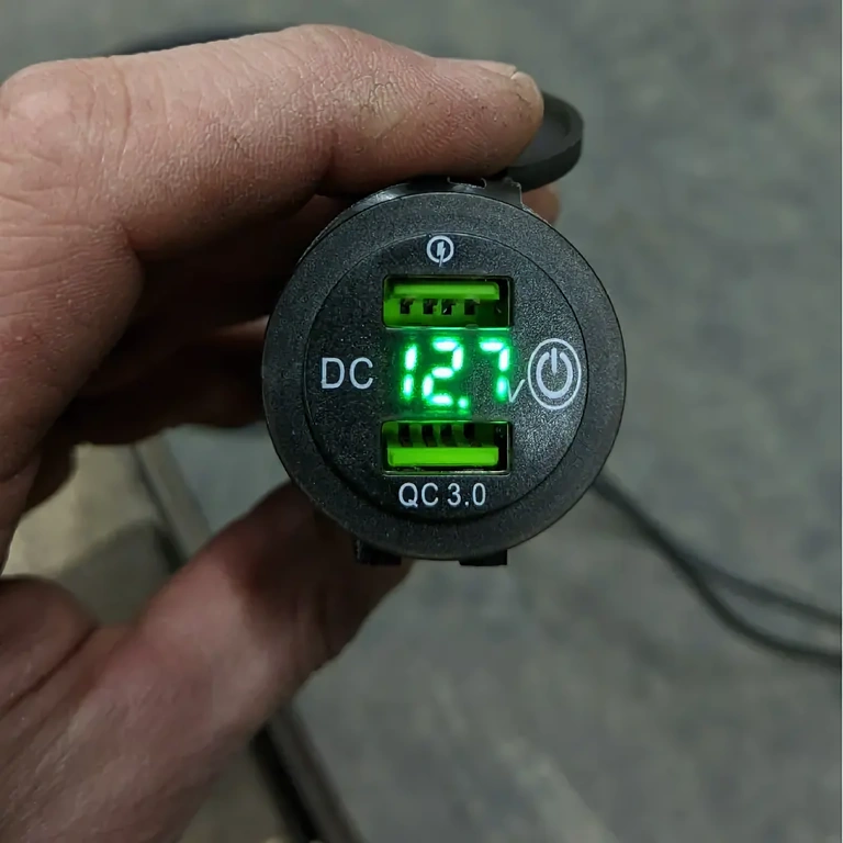 Dual-port USB charger for motorcycle and bicycle handlebars