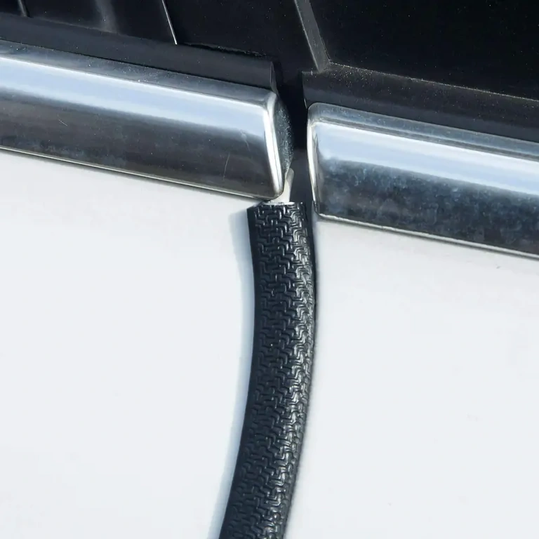 Rubber strip for sealing and protecting car doors