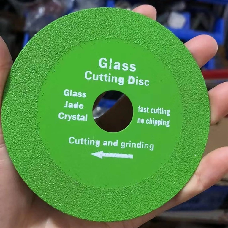 Diamond glass disc held in hand to show size