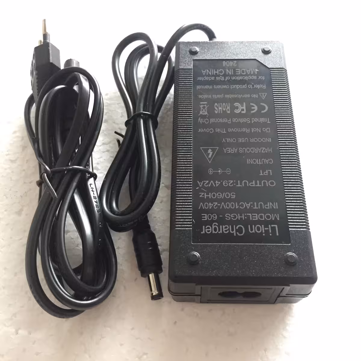 24V 2A charger – rear view with connector and technical label