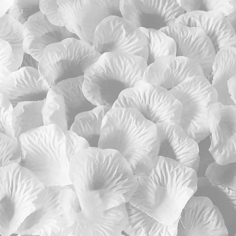 Artificial white petals for romantic decor on bed or floor